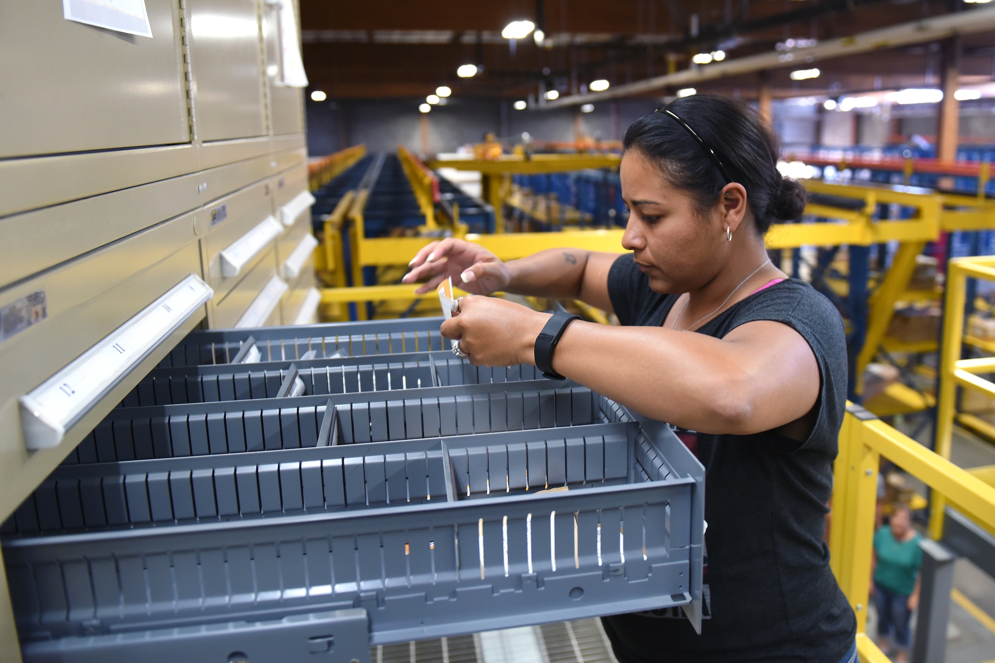 Annette Perez, 341st Logistics Readiness Squadron materiel management repair cycle, checks supply stock after a recent upgrade to the storage aid systems at the Central Storage Element June 30, 2015, at Malmstrom Air Force Base, Mont. With more than 100,000 pieces of inventory the CSE is critical to the base having the supplies and equipment on hand.  (U.S. Air Force photo/Chris Willis)