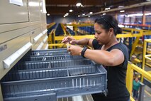 Annette Perez, 341st Logistics Readiness Squadron materiel management repair cycle, checks supply stock after a recent upgrade to the storage aid systems at the Central Storage Element June 30, 2015, at Malmstrom Air Force Base, Mont. With more than 100,000 pieces of inventory the CSE is critical to the base having the supplies and equipment on hand.  (U.S. Air Force photo/Chris Willis)