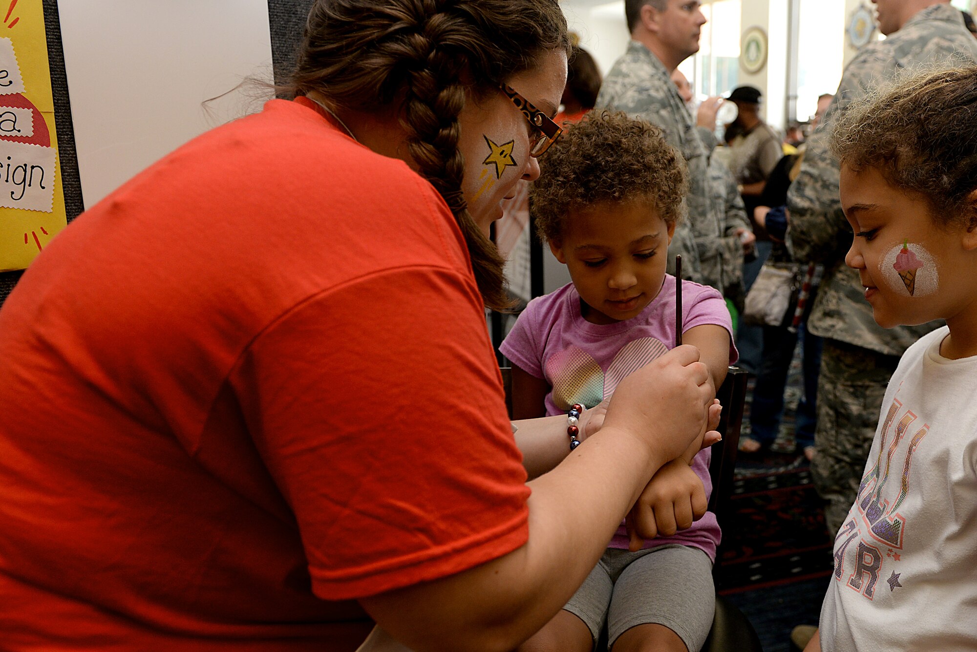 Members of Team Scott and their family members came out to the Scott Club for the annual base picnic June 26, 2015 at Scott Air Force Base, Ill. The picnic included game booths, information booths, a vehicle display, and free food for all. (U.S. Air Force photo/ Airman 1st Class Kiana Brothers)