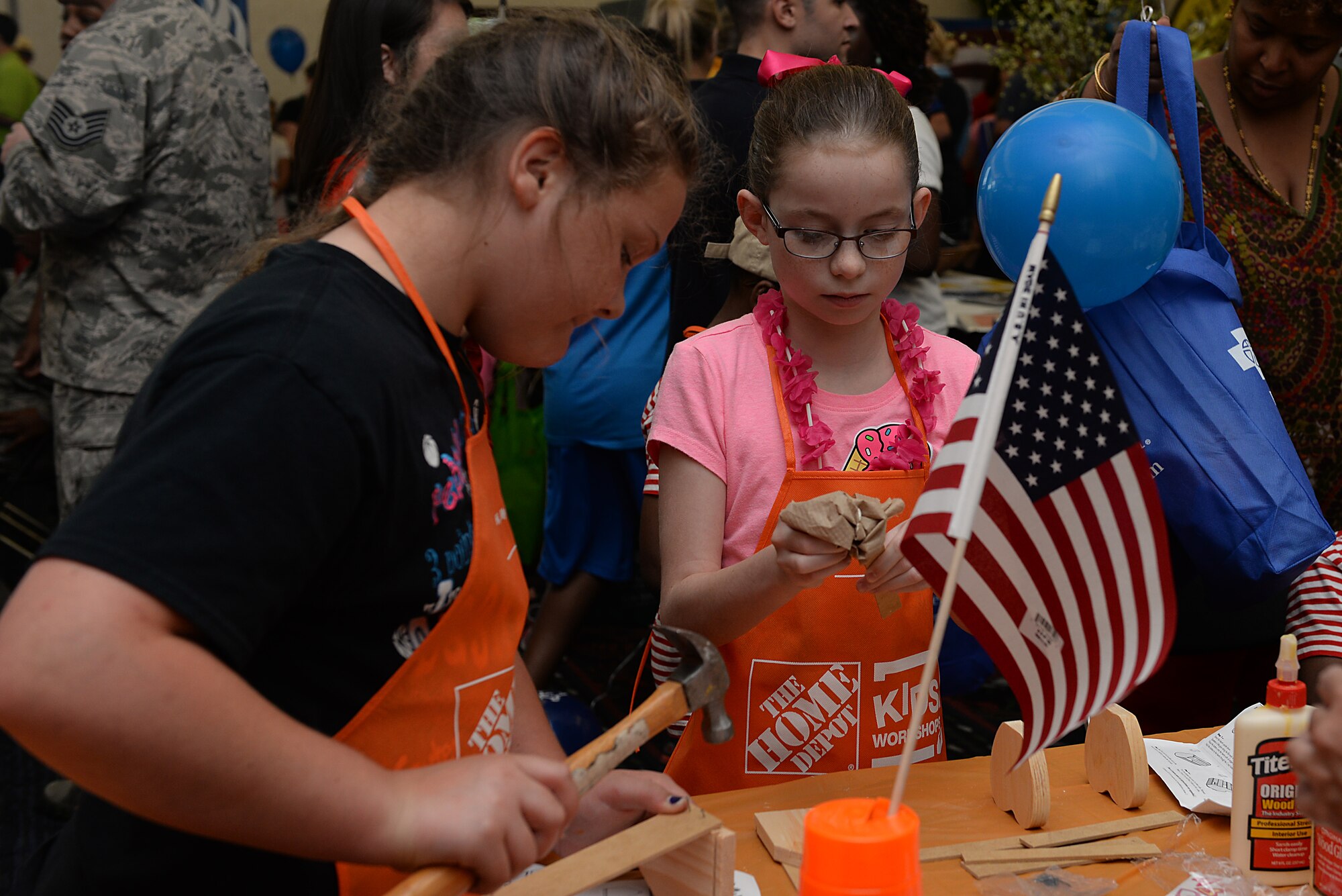 Members of Team Scott and their family members came out to the Scott Club for the annual base picnic June 26, 2015 at Scott Air Force Base, Ill. Children were able to enjoy building crafts, ice cream, popcorn, and many other activities during the day. The picnic included game booths, information booths, a vehicle display, and free food for all. (U.S. Air Force photo/ Airman 1st Class Kiana Brothers)