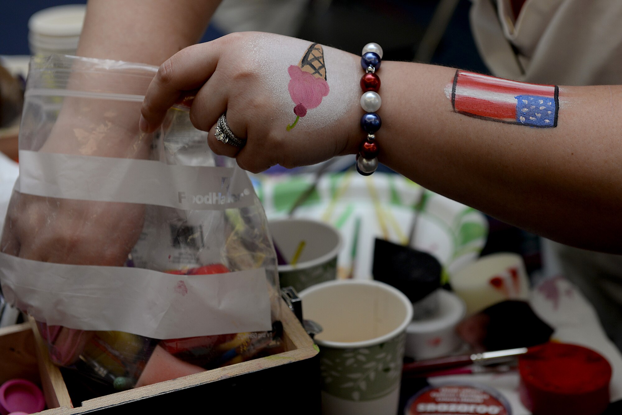 Many base organizations and local community sponsors supported Scott's base-wide picnic June 26, 2015 at Scott Air Force Base, Ill. Members of Team Scott visited the various booths for giveaways , promotional items, prizes, and brief information on each organization. (U.S. Air Force photo/ Airman 1st Class Kiana Brothers)
