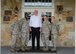 David Coker, Fisher House Foundation president (center), poses with the Fisher House for Families of the Fallen Managers on Duty June 26, 2015 during his visit to the 50th Fisher House. The Fisher House was gifted to the Air Force for families of the fallen Nov. 10, 2010 on behalf of the Fisher House Foundation. More than 3,000 family members of fallen service members have stayed in the Fisher House.  (U.S. Air Force photo/Senior Airman Stacy Buckley)