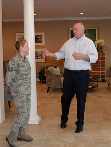 David Coker, Fisher House Foundation president, (center) poses with the Fisher House for Families of the Fallen Managers on Duty June 26, 2015 during his visit to the 50th Fisher House. The Fisher House was gifted to the Air Force for families of the fallen Nov. 10, 2010 on behalf of the Fisher House Foundation. More than 3,000 family members of fallen service members have stayed in the Fisher House.  (U.S. Air Force photo/Senior Airman Stacy Buckley)