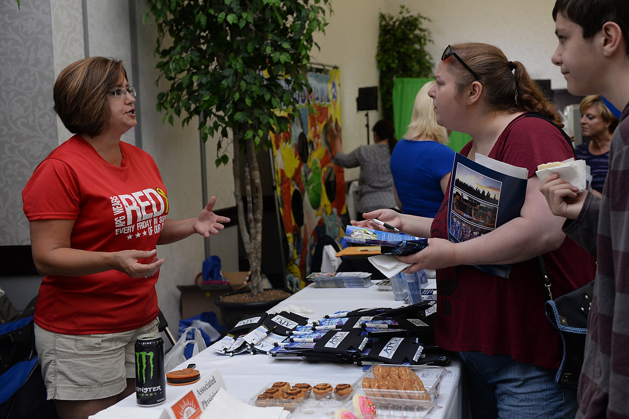 Many base organizations and local community sponsors supported Scott's base-wide picnic June 26, 2015 at Scott Air Force Base, Ill. Members of Team Scott visited the various booths for giveaways , promotional items, prizes, and brief information on each organization. (U.S. Air Force photo/ Airman 1st Class Kiana Brothers)