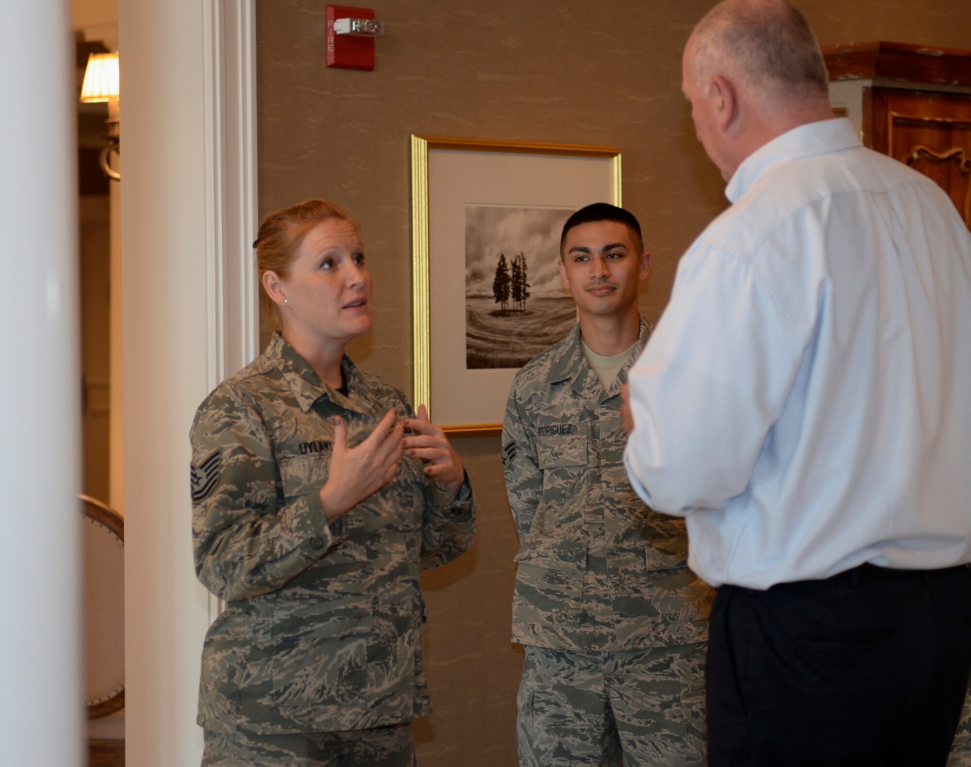 Tech. Sgt. Cheryl Uylaki, Air Force Mortuary Affairs Operations Fisher House NCO in charge, greets David Coker, Fisher House Foundation president June 26, 2015 at the Fisher House for Families of the Fallen, Dover Air Force Base, Del. The house was the 50th Fisher House dedicated and the first of its kind. This was Coker's first visit to the house since the dedication in November 2010. More than 3,000 family members of fallen service members have stayed in the Fisher House.  (U.S. Air Force photo/Senior Airman Stacy Buckley)