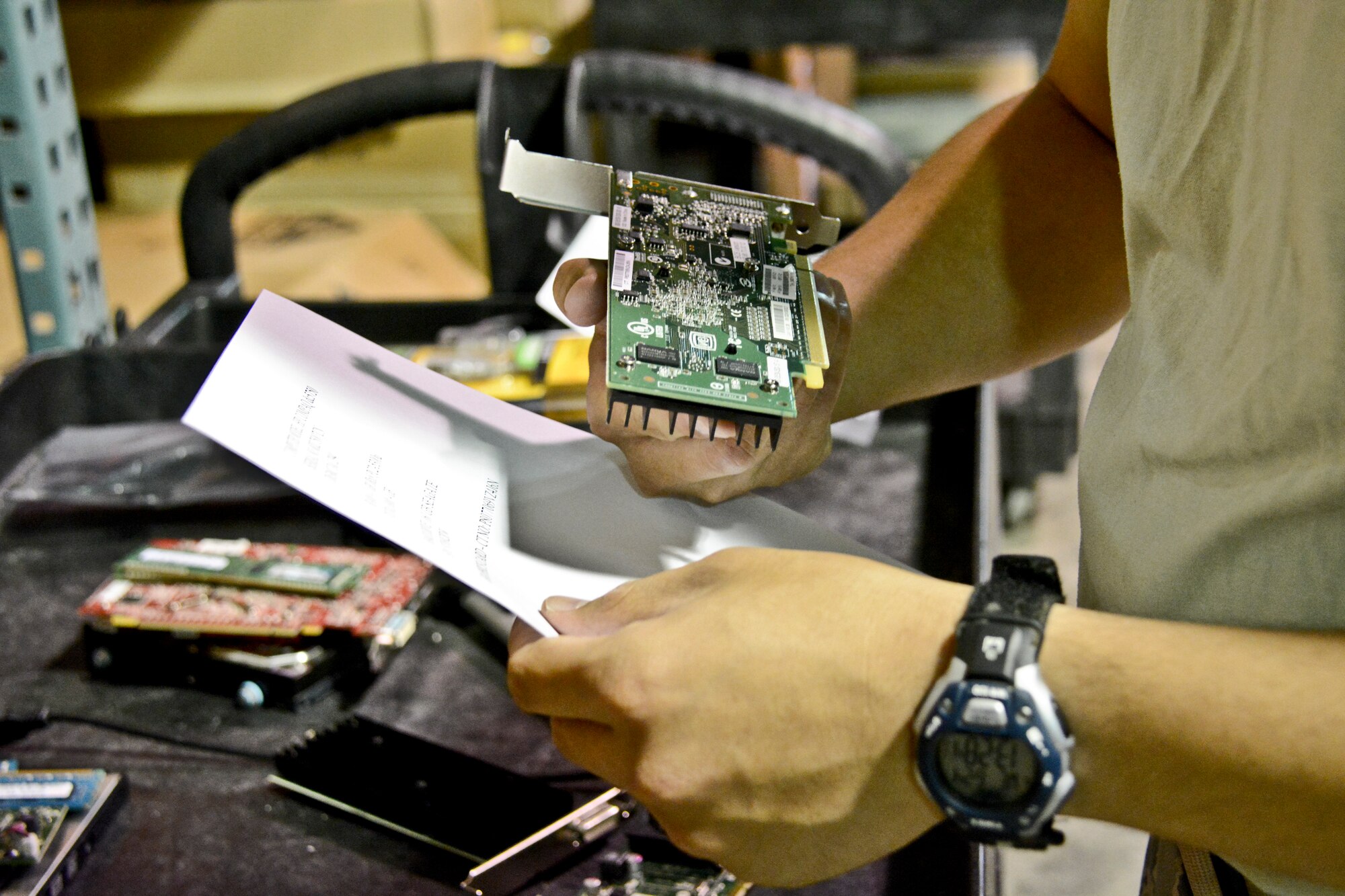 Airman 1st Class Mark Baccaro, 60th Medical Support Squadron systems warehouse technician, checks computer equipment to a supply list June 24 at the David Grant USAF Medical Center at Travis Air Force Base, California. The information systems flight makes sure all of the computers in the hospital are up to date and functioning properly. (U.S. Air Force photo by Airman 1st Class Amber Carter)