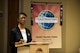 Emanuella McCall, outgoing Moody Talking Tigers president, speaks before the 2015 MTT inauguration ceremony June 25, 2015, at Moody Air Force Base, Ga. Jerry Bullard, 23d Civil Engineer Squadron locksmith, replaced McCall as the new MTT president. (U.S. Air Force photo by Airman 1st Class Dillian Bamman/Released)