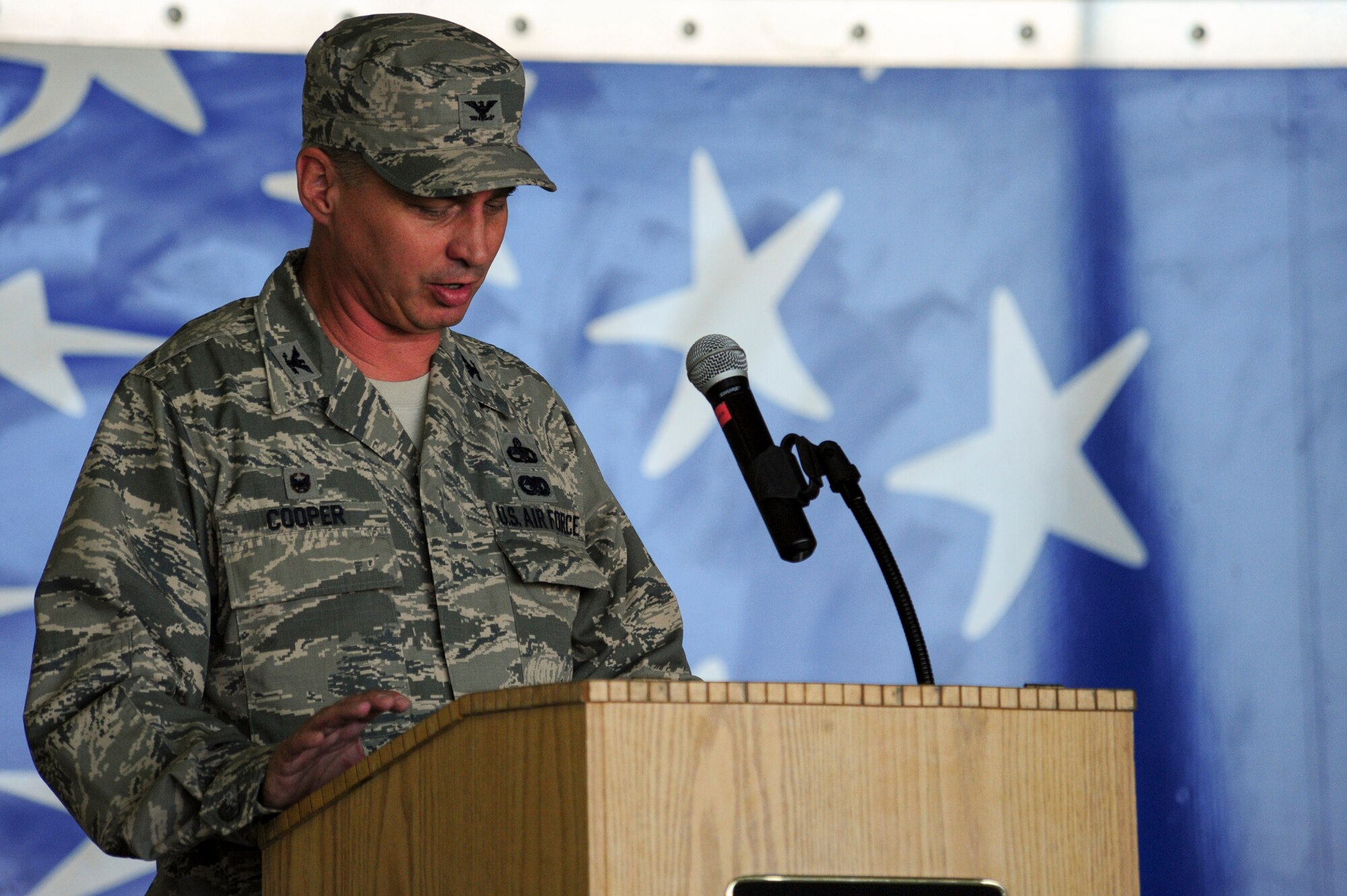 Col. Shannon Cooper, incoming 4th Maintenance Group commander, address his Airmen for the first time since assuming command, June 29, 2015, at Seymour Johnson Air Force Base, North Carolina. Cooper generously thanked his predecessor, Col. Darrell Steele, for laying a solid foundation and relayed his vision for the future to continue to build upon it. (U.S. Air Force photo/Senior Airman Brittain Crolley)