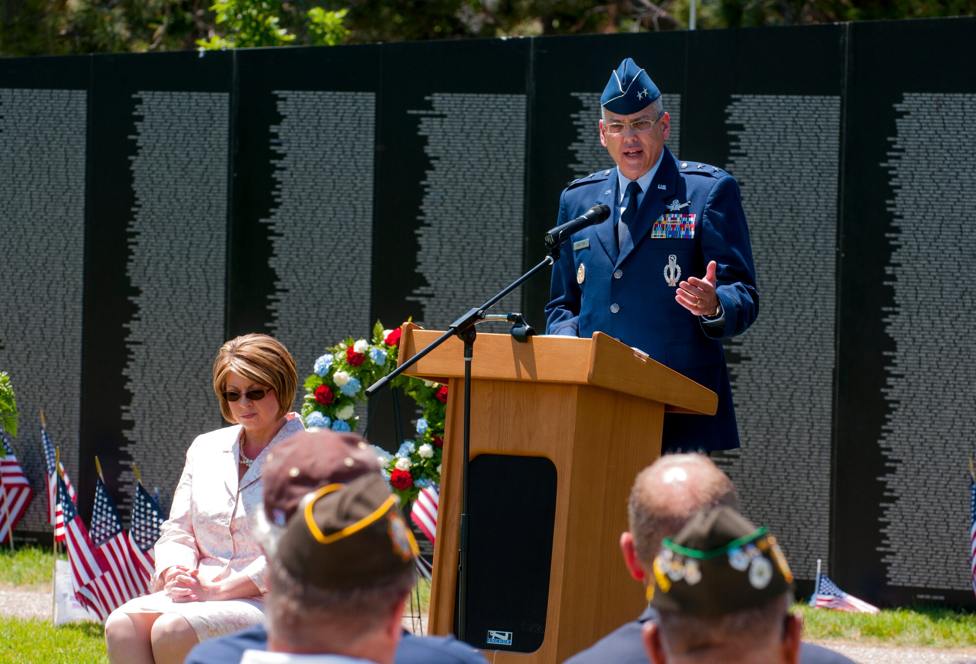 Maj. Gen. Jack Weinstein, 20th Air Force and Task Force 214 commander, F.E. Warren Air Force Base, Wyo., addresses the audience June 28, 2015, at the closing ceremony of the American Veterans Traveling Tribute visit to Cheyenne, Wyo. The five-day event took place in Lions Park in Cheyenne, drawing crowds day and night who paid homage to fallen Americans. (U.S. Air Force photo by Airman 1st Class Malcolm Mayfield)