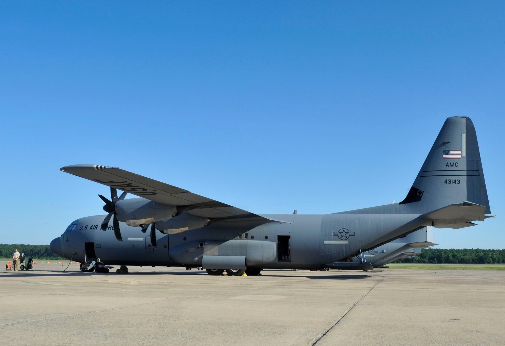 A C-130J parked on the flightline is prepared for an iron swap mission June 9, 2015, at Little Rock Air Force Base, Ark. Iron swap missions can take up to 10 days or more to complete. (U.S. Air Force photo by Senior Airman Stephanie Serrano)