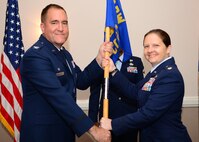 Maj. Jennifer McGee assumes command of the 2nd Contracting Squadron from Col. Craig Harding, 2nd Mission Support Group commander, during a change of command ceremony on Barksdale Air Force Base, La., June 30, 2015. McGee commissioned into the Air Force Nov. 15, 2001, and has held contracting positions in operational, specialized and systems contracting organizations. Prior to joining the 2nd CS, McGee was a student at the Air Command and Staff College, Maxwell Air Force Base, Ala. (U.S. Air Force photo/Senior Airman Benjamin Raughton)