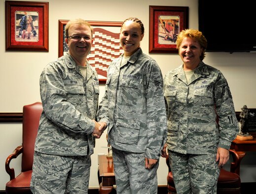 Col. Bill Otter, 19th Airlift Wing vice commander, along with Chief Master Sgt. Rhonda Buening, 19th Airlift Wing command chief, congratulate Senior Airman Teyler-Symone Williams, a 19th Airlift Wing administrator, for her selection as Combat Airlifter of the Week June 29, 2015, at Little Rock Air Force Base, Ark. Williams is a phenomenal contributor to the front office staff. (U.S. Air Force photo by Senior Airman Stephanie Serrano)