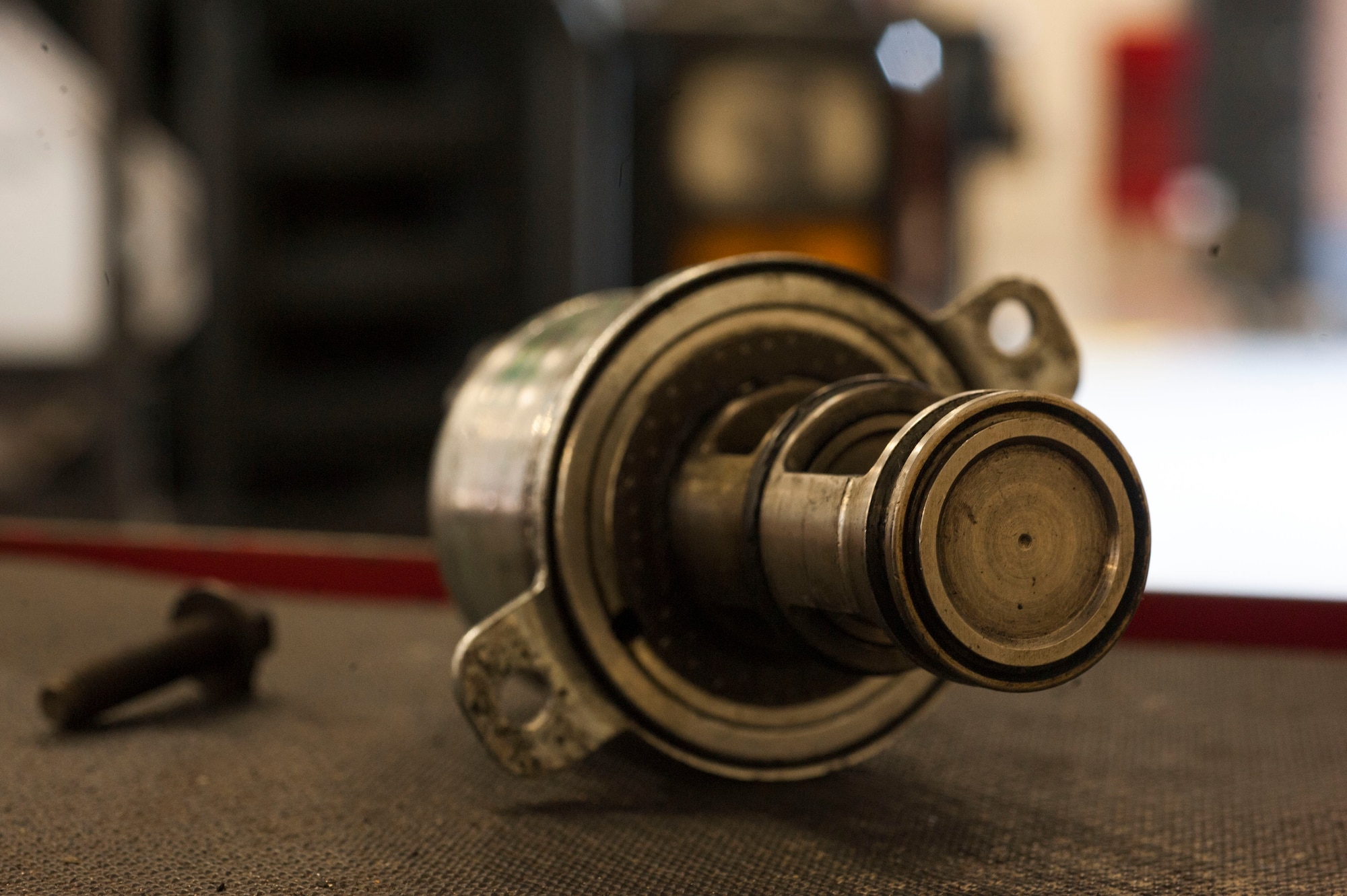 An oil filter mount rests on a toolbox during a daily maintenance operation June 30, 2015, at Moody Air Force Base, Ga.  Airmen from the 23d Logistics Readiness Squadron Vehicle Management Flight replaced the mount after checking a government operated vehicle’s oil system for leaks. (U.S. Air Force photo by Airman 1st Class Dillian Bamman/Released)