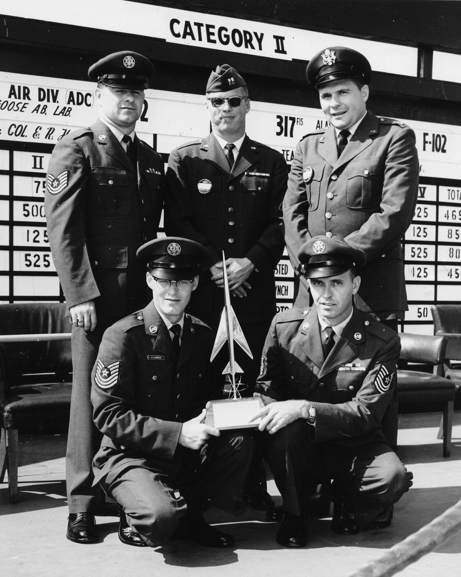 TYNDALL AIR FORCE BASE, Fla. - Capt. Edmund Morrisey, top center, pictured here in 1963 with personnel from the Pennsylvania Air National Guard's 146th Fighter Interceptor Squadron and members of the Colorado and Utah Air National Guard who were among the first Air National Guard teams to win the Air Force's William Tell aerial gunnery competition. (U.S. Air Force file photo/Released)