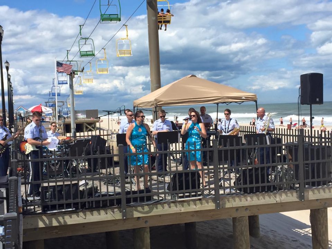 High Altitude had the spotlight on a stage on the Boardwalk at Seaside Heights NJ on Sunday June 28, 2015.  Beachgoers were thrilled and entertained with the group's high energy performance of popular music hits. (U.S. Air Force Photo/Master Sgt. Brian Stike)