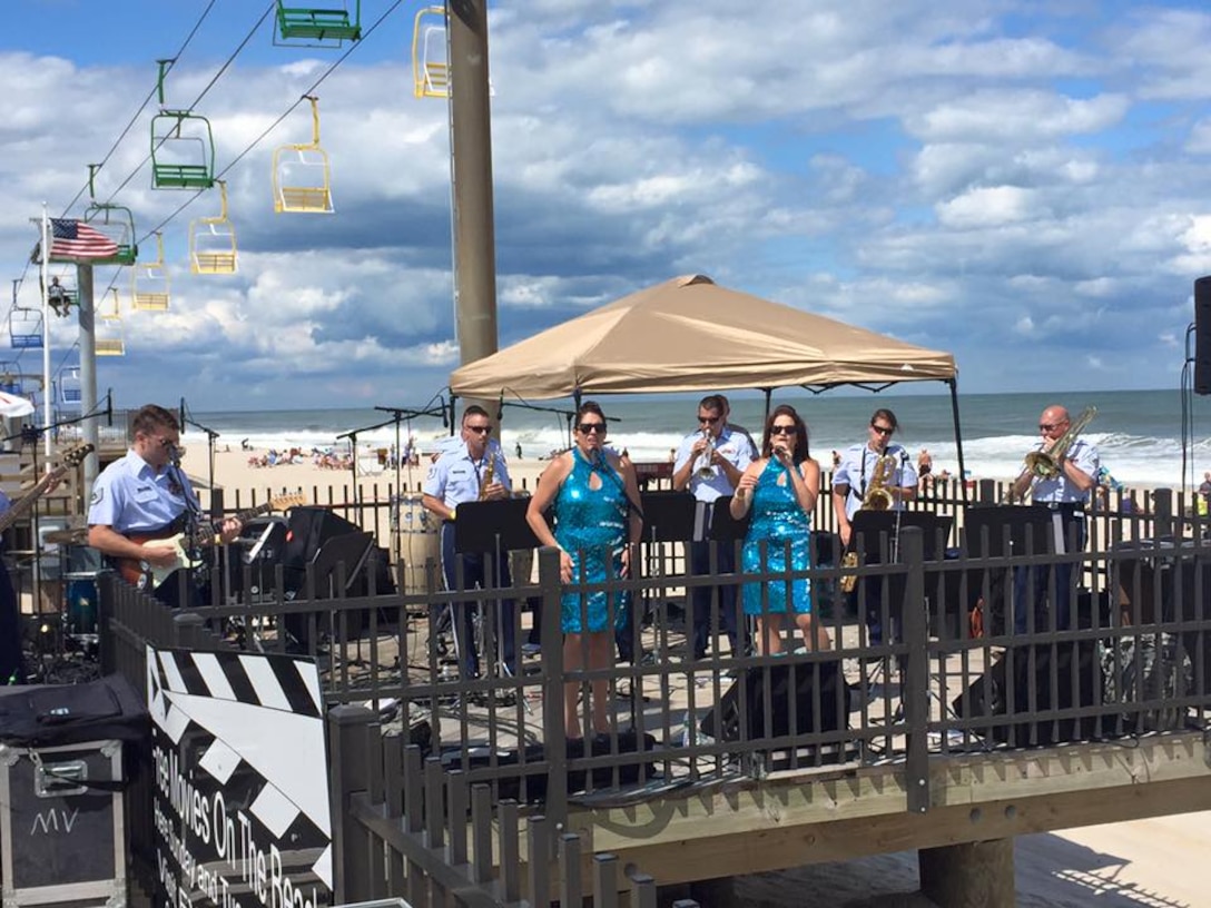 High Altitude had the spotlight on a stage on the Boardwalk at Seaside Heights NJ on Sunday June 28, 2015.  Beachgoers were thrilled and entertained with the group's high energy performance of popular music hits. (U.S. Air Force Photo/Master Sgt. Brian Stike)
