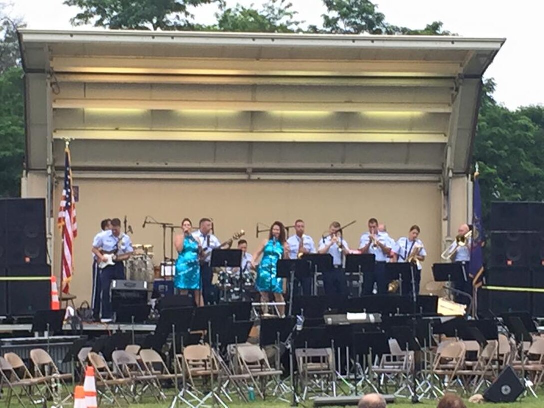 High Altitude performs in Flemington NJ on Thursday June 25, 2015. High Altitude was able to perform a few numbers for the crowd.  The audience came out despite the threat of rain, but before long the concert had to be called for rain. (U.S. Air Force Photo/Master Sgt. Brian Stike)