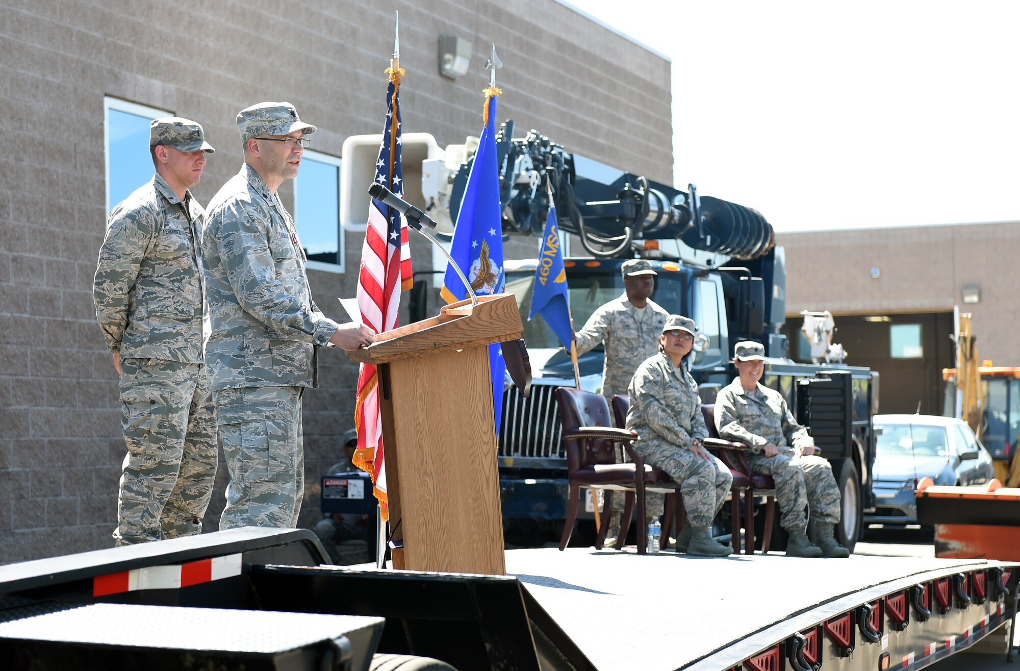 Lt. Col. Allen Theibeaux, prior 460th Civil Engineer Squadron commander, addresses the squadron during the change of command ceremony June 30, 2015, on Buckley Air Force Base, Colo. Theibeux has been in command of the 460th CES since June 2013, where he led the squadron through fiscal challenges, damaging weather events and decreases in manpower. (U.S. Air Force photo by Airman 1st Class Emily E. Amyotte/Released)