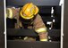 ALTUS AIR FORCE BASE, Okla. – A firefighter weaves through wooden beams during confined space entry maze training at Altus AFB, June 24, 2015. The firefighters maneuvered through the short, narrow obstacle course blindfolded and in full gear. The purpose of this training was to teach the firefighters how to control their breathing and how to not panic in restricted environments. (U.S. Air Force photo by Airman 1st Class Megan E. Acs/Released)