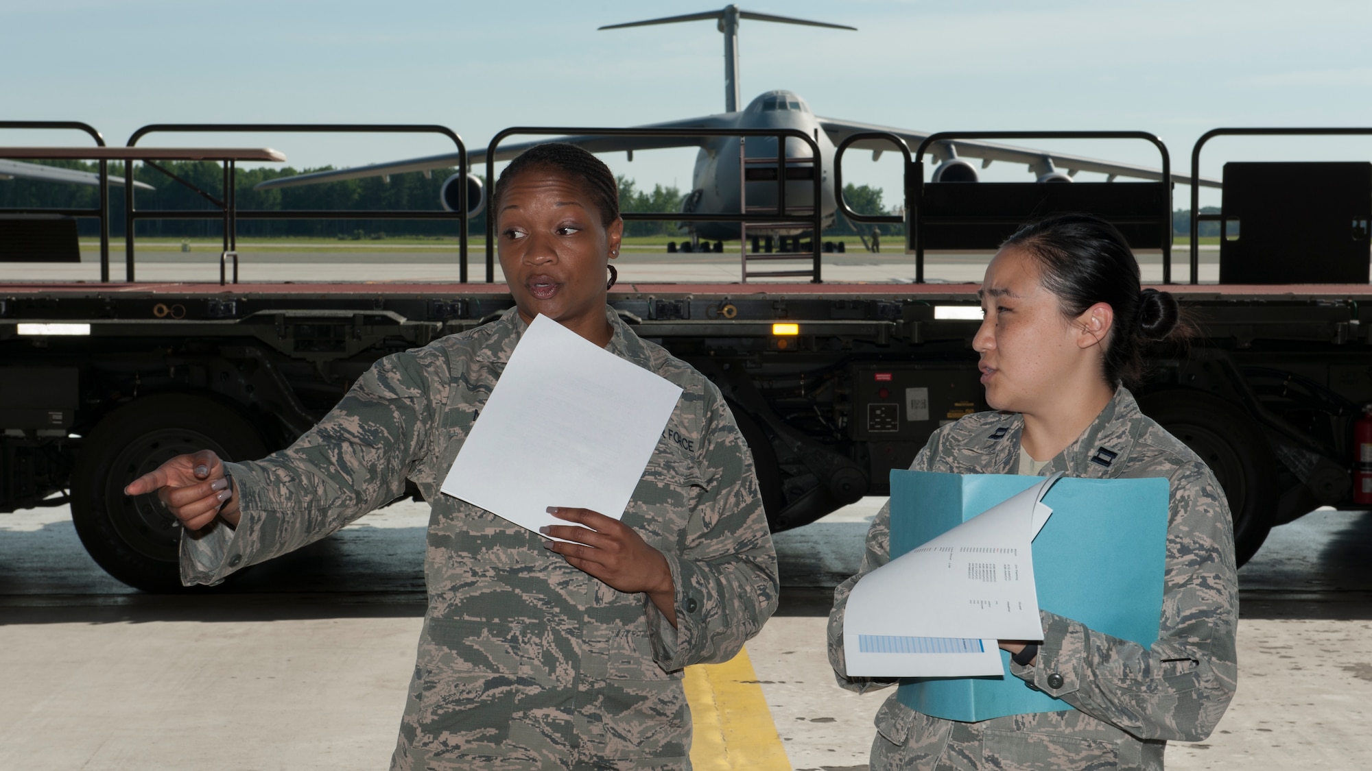 Staff Sgt. Evelyn Neal, 436th Airlift Wing Protocol specialist, and Capt. Rachel Van Sciver, 373d Training Squadron Detachment 3 commander, discuss the proper protocol aspects during a retirement ceremony rehearsal June 25, 2015, at Dover Air Force Base, Del. Neal is currently on special-duty with the Protocol Office. (U.S. Air Force photo/Airman 1st Class Zachary Cacicia)