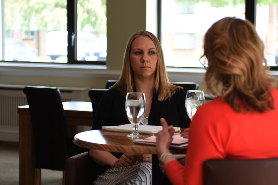 Katy Shipman, 423rd Medical Squadron key spouse, left, listens as Janet Driggers, 501st Combat Support Wing key spouse, discusses her motivation behind becoming a key spouse, during an informal meeting at RAF Alconbury, United Kingdom, May 13, 2015. Driggers said she is strongly motivated to help others in what she calls her “Air Force family.” (U.S. Air Force photo by Staff Sgt. Jarad A. Denton/Released)