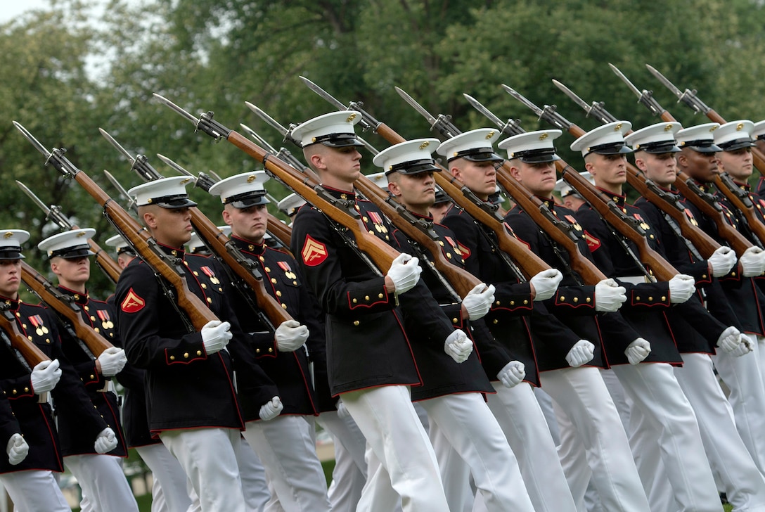 Marines march during a pass in review as part of the Marine Corps ...