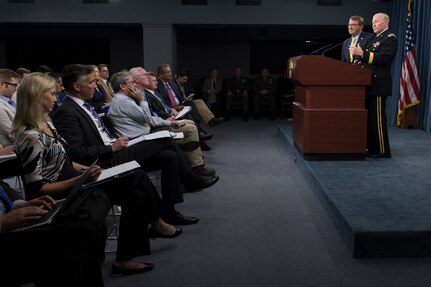 Secretary of Defense Ash Carter and 18th Chairman of the Joint Chiefs of Staff Gen. Martin E. Dempsey brief the press in the Press Briefing Room at the Pentagon, July 1, 2015.
