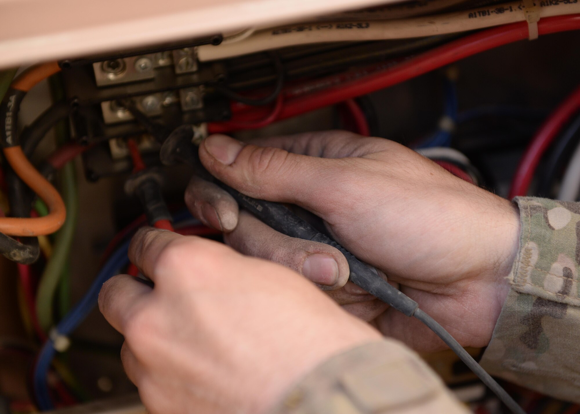 U.S. Air Force Staff Sgt. Russell Dutcher, 455th Expeditionary Civil Engineer Squadron HVAC technician, repairs an air conditioning unit June 30, 2015, at Bagram Airfield, Afghanistan. Dutcher, who is part of the 1000s of Hands project, is responsible for responding to all work orders dealing with AC problems as well as keeping Bagram’s mission equipment such as computers and servers cool. (U.S. Air Force photo By Senior Airman Cierra Presentado/Released)