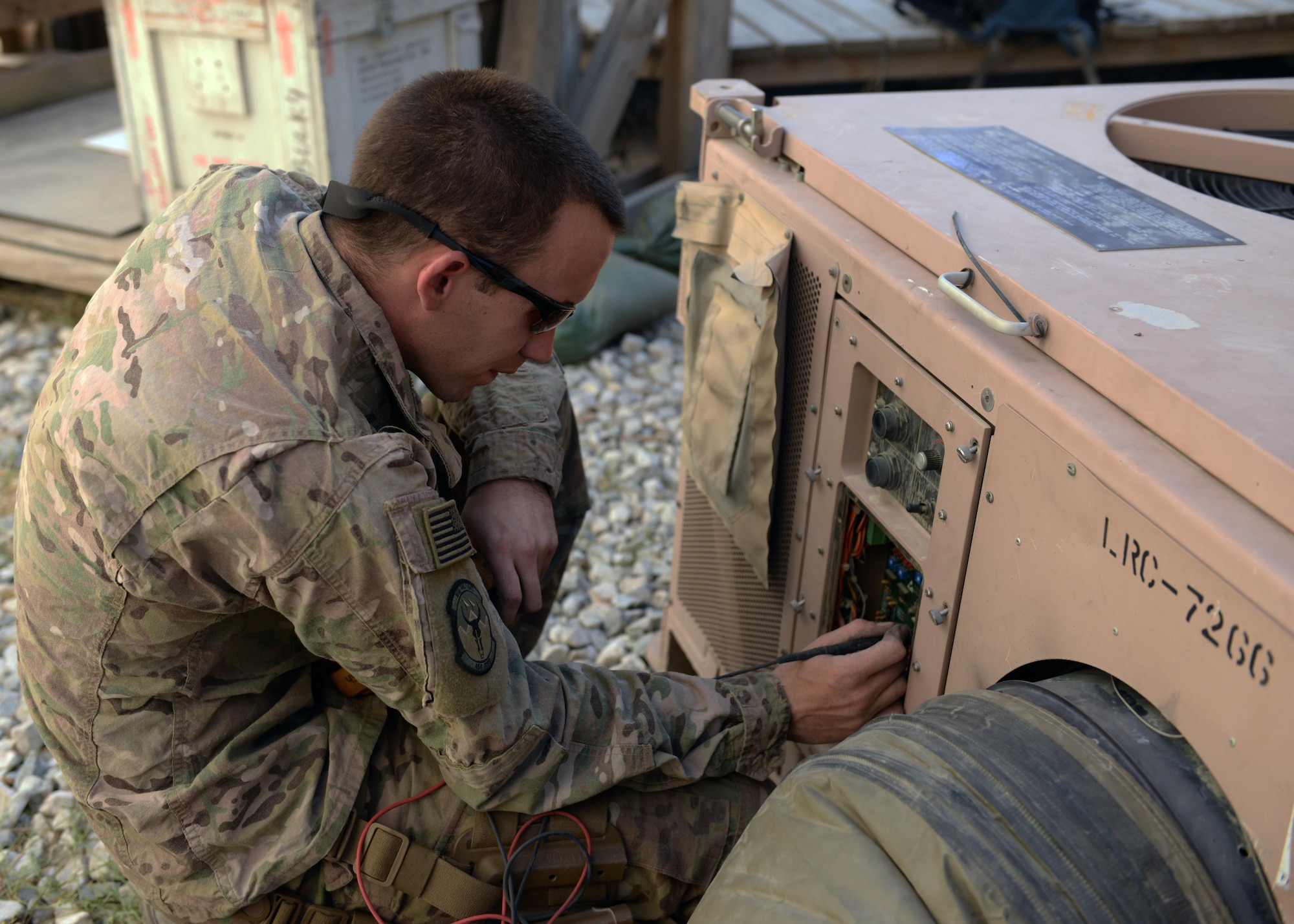 U.S. Air Force Staff Sgt. Russell Dutcher, 455th Expeditionary Civil Engineer Squadron HVAC technician, repairs an air conditioning unit June 30, 2015, at Bagram Airfield, Afghanistan. Dutcher, who is part of the 1000s of Hands Project, is responsible for responding to all work orders dealing with AC problems as well as keeping Bagram’s mission equipment such as computers and servers cool. (U.S. Air Force photo By Senior Airman Cierra Presentado/Released)