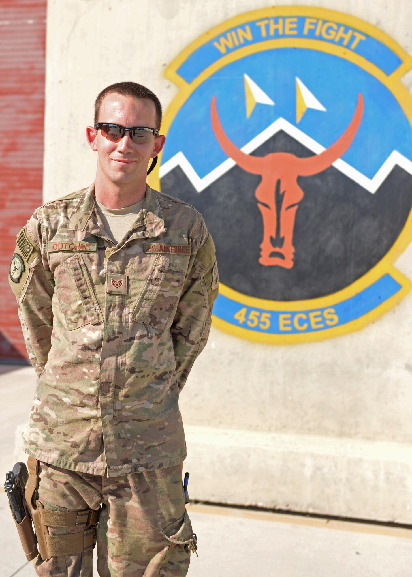U.S. Air Force Staff Sgt. Russell Dutcher, 455th Expeditionary Civil Engineer Squadron, HVAC technician, poses for a photo June 30, 2015, at Bagram Airfield, Afghanistan. Dutcher who is part of the 1000s of Hands Project, is responsible for responding to all work orders dealing with AC problems as well as keeping Bagram’s mission equipment such as computers and servers cool. (U.S. Air Force photo by Senior Airman Cierra Presentado/Released)