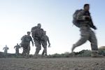 Competitors in the 2015 Army National Guard Best Warrior Competition at Camp Williams, Utah, step off at the start of the ruck march event  June 23, 2015. The competition tests competitors on a variety of tactical and technical skills physically and mentally demanding three days as they vie to earn the title of Best Warrior and become the Soldier and Noncommissioned Officer of the Year for the Army Guard. The winners of the competition will then represent the Army Guard in the Department of the Army level Best Warrior Competition later this year.