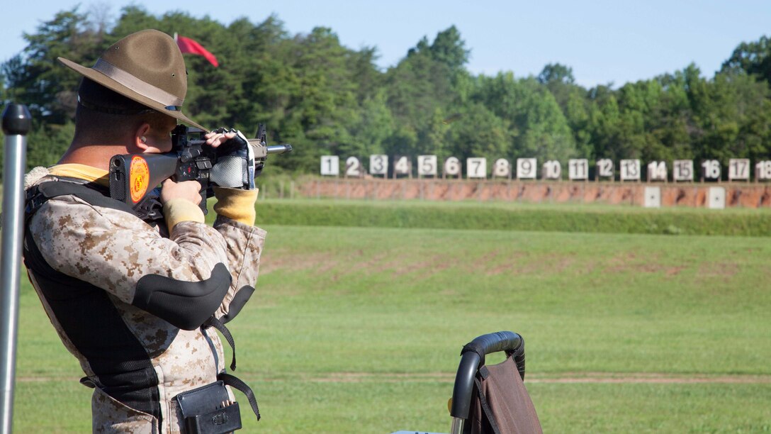 Staff Sgt. Chad Ranton fires an M16A4 service rifle during the Marine Corps Combat Development Command Team Match at Marine Corps Base Quantico, Virginia, June 29, 2015. The match is part of the 54th Interservice Rifle Championship held at MCB Quantico from June 25 - July 1. The Marine Corps Shooting Team will spend months of training to develop muscle memory and conditioning to prepare them for rifle matches throughout the military and the nation. Ranton is a member of the Marine Corps Shooting Team.