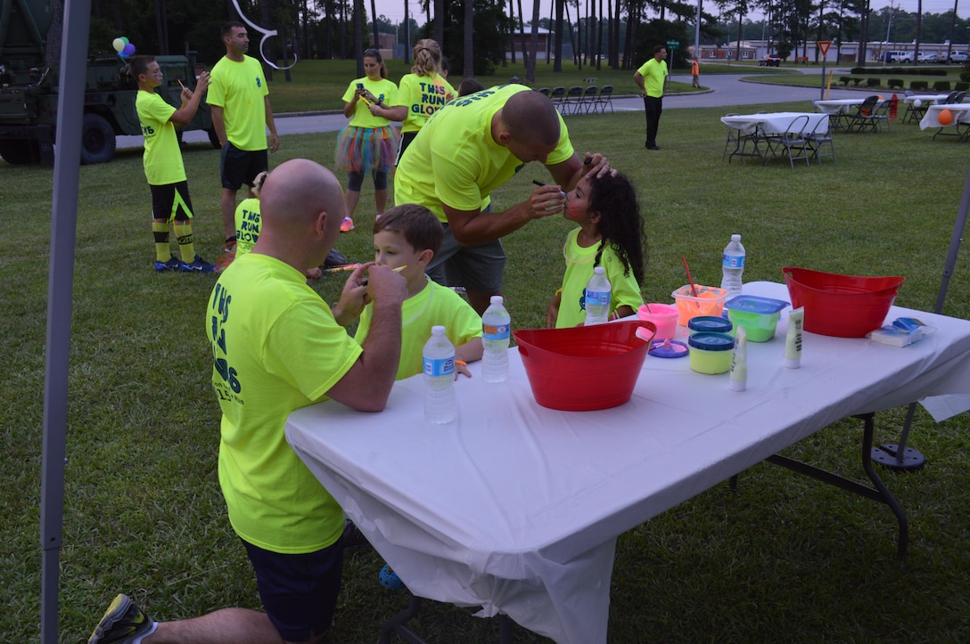 The 8th Communication Battalion Glow. Friends and family took time out of their evening to enjoy a festive and lively night out while running/walking in a 5K glow run. Music, face painting, coloring, and a black light photo booth were some of the highlighted activities for families to take part in. Runners/walkers enjoyed a nice night and a great time with friends as they crossed the finish line with smiles on their faces and enjoyed some fresh fruit and conversation with new friends