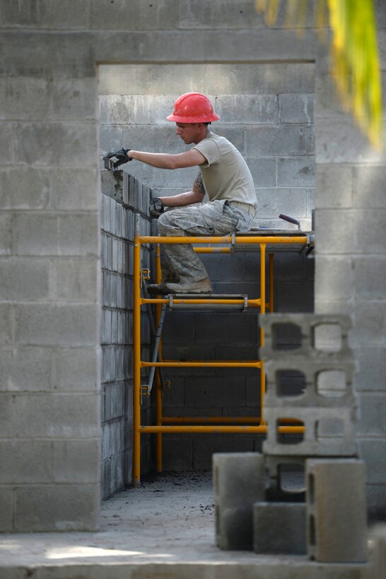 Staff Sgt. Dustin Haycox, an 823rd Expeditionary RED HORSE Squadron structural craftsman from Hurlburt Field, Fla., builds an inner wall of a new two-classroom schoolhouse in the village of Ocotes Alto, Honduras, June 27, 2015. The schoolhouse is part of the New Horizons Honduras 2015 training exercise. The exercise improves joint readiness of U.S. and partner nation civil engineers, medical professionals, and support personnel through humanitarian assistance activities. (U.S. Air Force photo/Capt. David J. Murphy)
