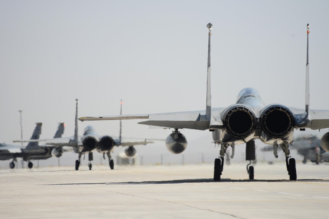 Several F-15 Eagles from the 493rd Fighter Squadron at Royal Air Force Lakenheath, England, taxi to the runway during the final day of Anatolian Eagle June 18, 2015, at 3rd Main Jet Base, Turkey. The 493rd FS recently received the 2014 Raytheon Trophy as the U.S. Air Force's top fighter squadron. (U.S. Air Force photo/Tech. Sgt. Eric Burks)