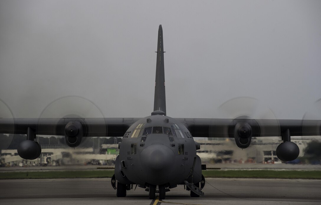 A modified C-130 Hercules assigned to the 910th Airlift Wing at Youngstown Air Reserve Station, Ohio, starts up on June 19, 2015, at Joint Base Charleston, S.C. The C-130 and aircrew sprayed to eradicate mosquitos on the Joint Base Charleston Weapons Station. The aerial spraying was performed at night to increase the chances of eliminating mosquitoes while reducing the risk of contaminating bees. (U.S. Air Force photo/Senior Airman Jared Trimarchi)