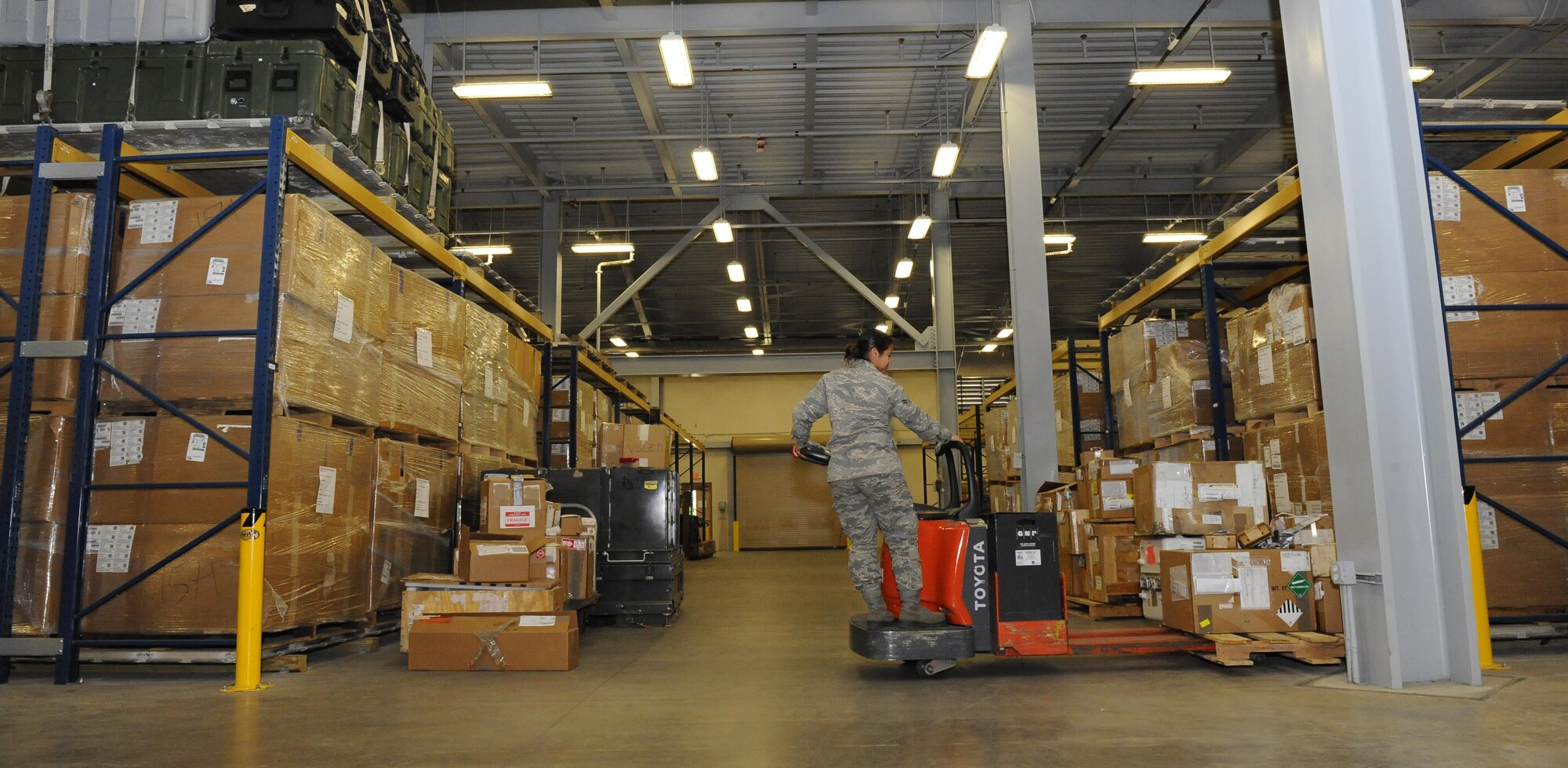 Airman 1st Class Diamond Artis, 1st Special Operations Logistics Readiness Squadron materiel management flight service center journeyman, lifts equipment supplies at Hurlburt Field, Fla., June 29, 2015. The materiel management flight stocks, stores, issues and receives 27,400 line items of supplies and equipment for Hurlburt Field. (U.S. Air Force photo/Airman 1st Class Andrea Posey)