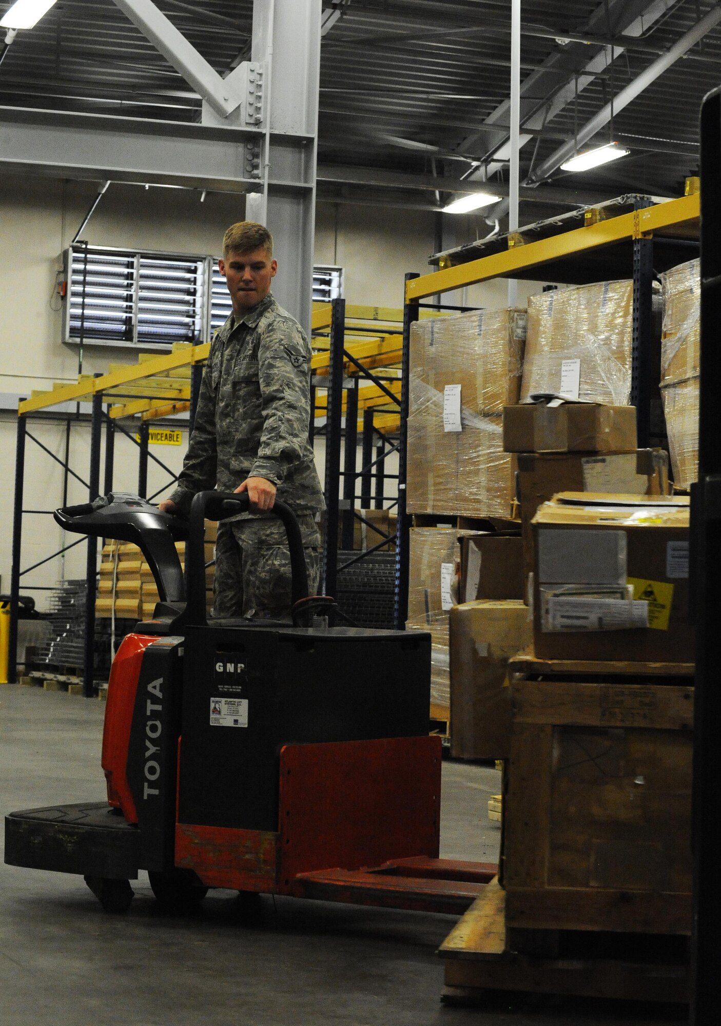 Airman 1st Class Lance Schumacher, 1st Special Operations Logistics Readiness Squadron materiel management flight service center journeyman, moves stock at Hurlburt Field, Fla., June 29, 2015. The materiel management flight stocks, stores, issues and receives 27,400 line items of supplies and equipment for Hurlburt Field. (U.S. Air Force photo/Airman 1st Class Andrea Posey)