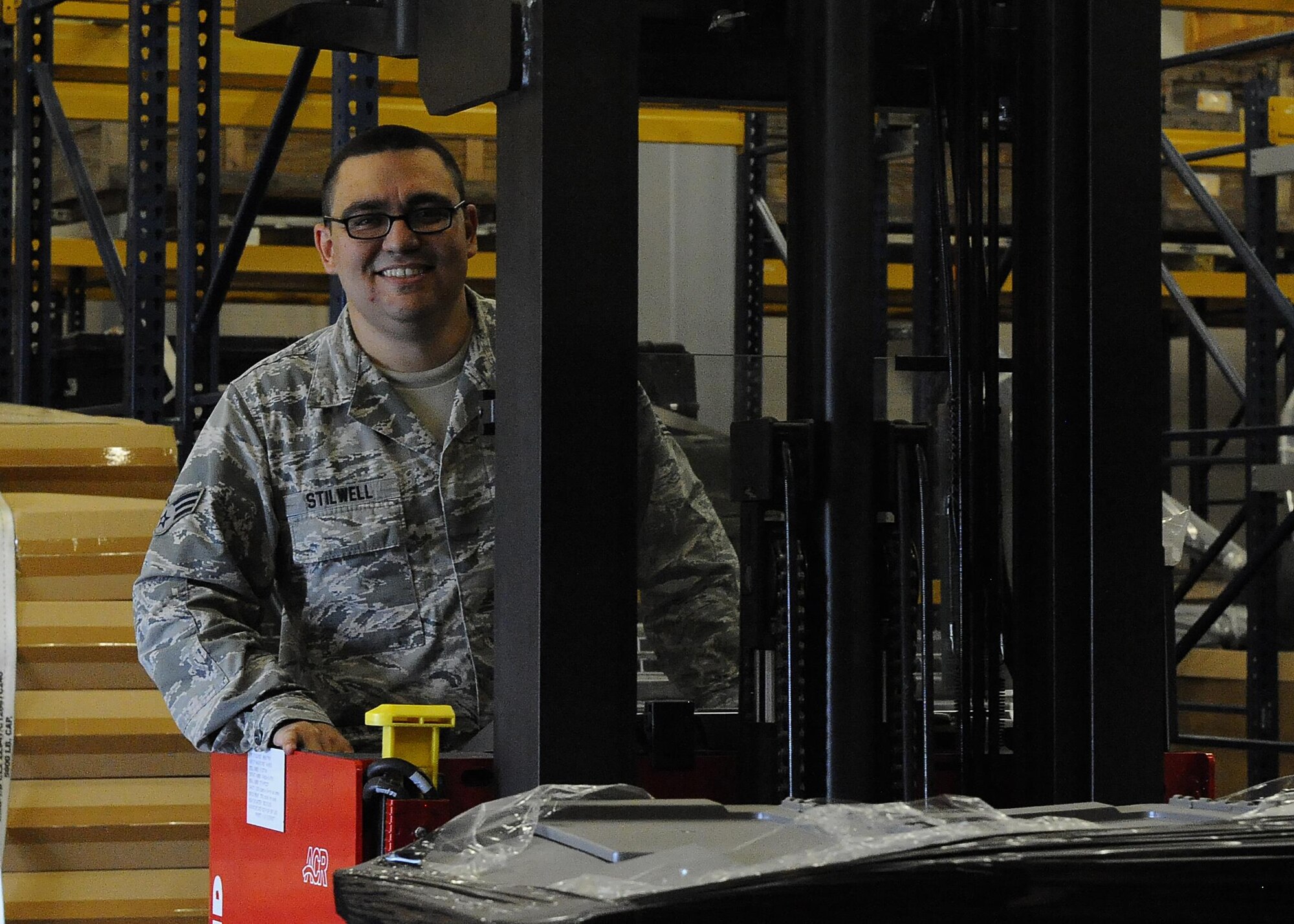 Senior Airman Matthew Stilwell, 1st Special Operations Logistics Readiness Squadron materiel management flight service center journeyman, operates warehouse equipment at Hurlburt Field, Fla., June 29, 2015. The materiel management flight stocks, stores, issues and receives 27,400 line items of supplies and equipment for Hurlburt Field. (U.S. Air Force photo/Airman 1st Class Andrea Posey)