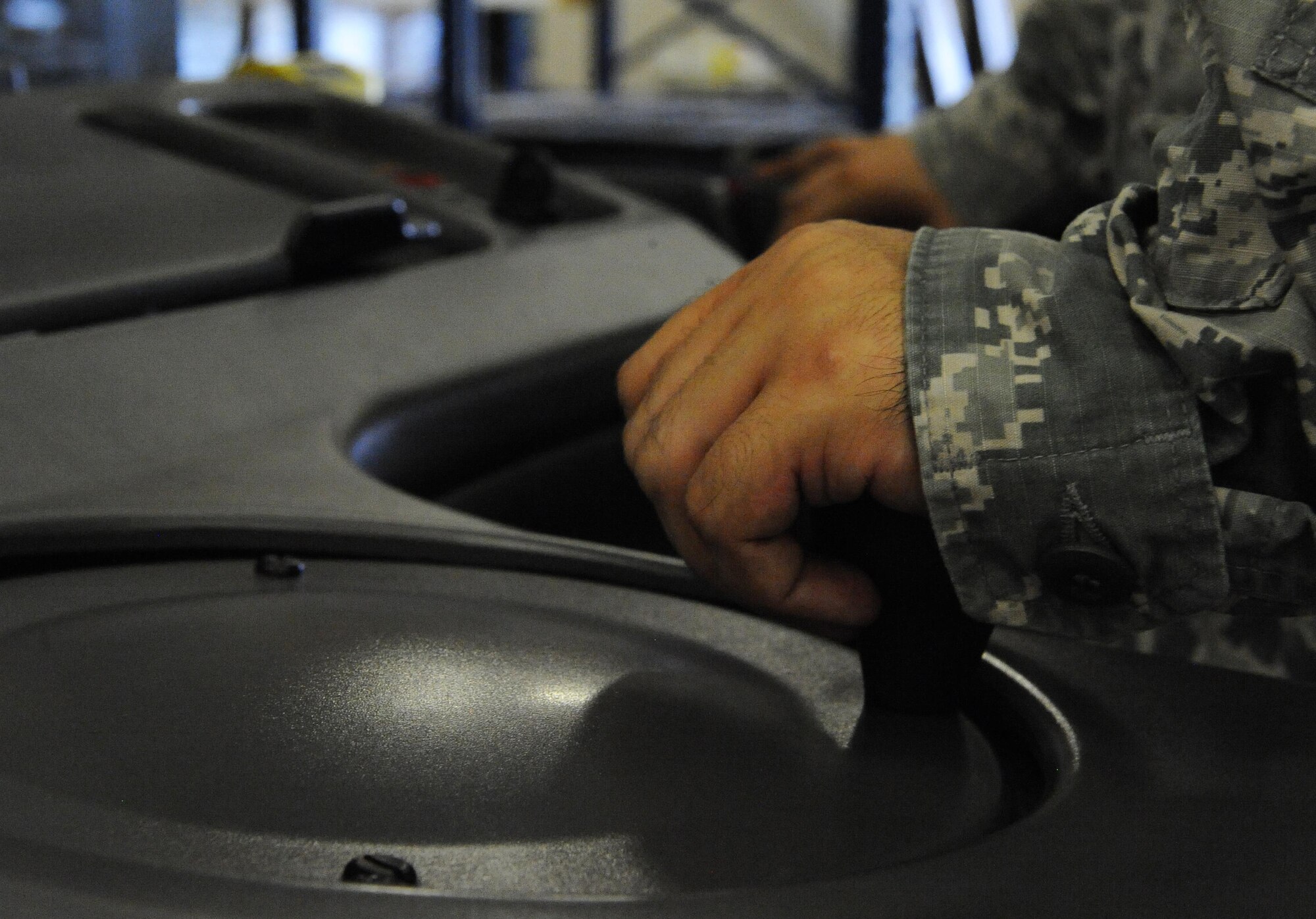 Senior Airman Matthew Stilwell, 1st Special Operations Logistics Readiness Squadron materiel management flight service center journeyman, operates heavy machinery at Hurlburt Field, Fla., June 29, 2015. The materiel management flight stocks, stores, issues and receives 27,400 line items of supplies and equipment for Hurlburt Field. (U.S. Air Force photo/Airman 1st Class Andrea Posey)
