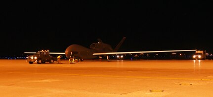 MISAWA AIR BASE, Japan (July 2, 2015) - An RQ-4 Global Hawk is towed off the runway after landing. This is one of several Global Hawks to arrive at Misawa for a summer to winter rotation. The aircraft will begin local area checks before its first operational flight in early July. 