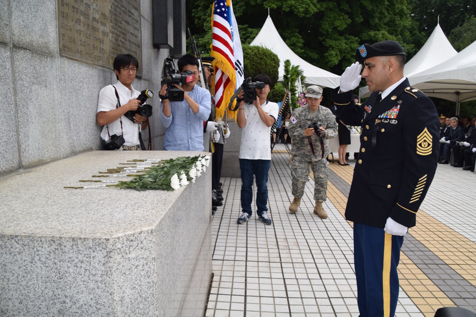 OSAN AIR BASE, South Korea (July 2, 2015)  - Staff Sgt. Heather A. Denby, 35th ADA Public AffairsCommand Sgt. Maj. Jose Villarreal, senior enlisted advisor to the commander of 35th Air Defense Artillery Brigade, pays tribute to the men of Task Force Smith during a memorial ceremony at Jukmiryeong War monument. Nearly 40 percent of the Soldiers who served in Task Force Smith lost their lives during the Battle of Osan. 