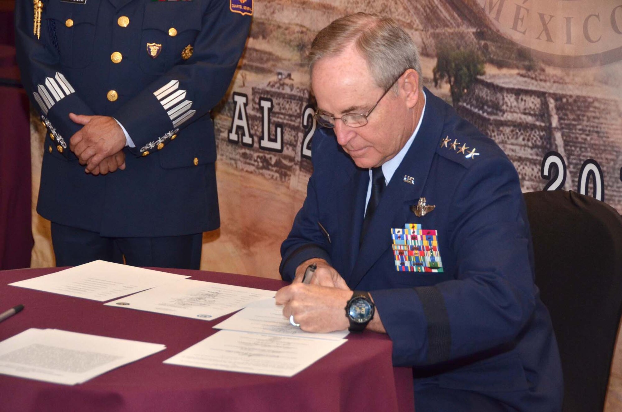 Air Force Chief of Staff Gen. Mark A. Welsh III signs an agreement at the conclusion of the Conference of American Air Chiefs June 25, 2015, in Mexico City. The conference is an annual event sponsored by the System of Cooperation Among American Air Chiefs, which is headquartered at Davis-Monthan Air Force Base, Ariz., and includes representatives from 20 Western Hemisphere air forces. (U.S. Air Force photo/Capt. Bryan Bouchard)