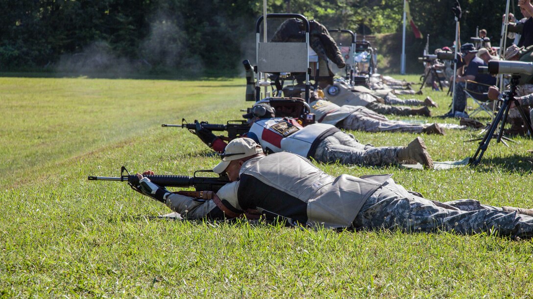 Soldiers with the U.S. Army Reserves fire down range during the 54th Interservice Rifle Championship at Marine Corps Base Quantico, Virginia, June 29, 2015. Participants in the competition fired from distances between 200 - 1000 yards in the standing, sitting, and prone positions. This will be the last time Department of Defense competitors will face off against each other before going to the National Rifle Matches held at Camp Perry, Ohio.