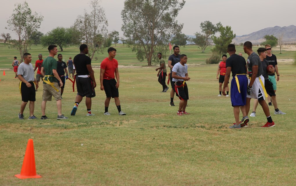 Marines and sailors from 7th Marine Regiment, play a game of flag football during the City of Palm Desert hosted 7th Marine Regiment Appreciation Day at the Desert Winds Golf Course, June 26, 2015. (Official Marine Corps photo by Lance Cpl. Medina Ayala-Lo/ Released)