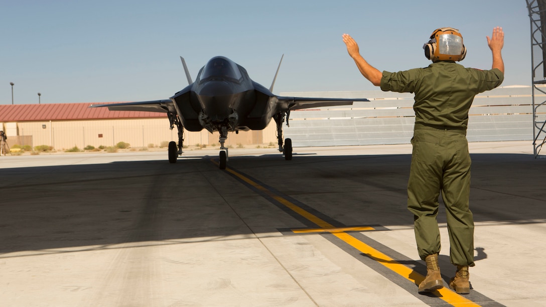 A F-35B Lightning II with Marine Operational and Test Evaluation Squadron 22 taxies under a canopy aboard Edwards Air Force Base, California, Oct. 9, 2014.  This is the squadron’s first F-35 Lightning II.
