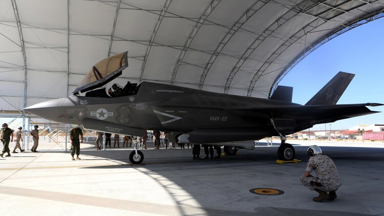 A F-35B Lightning II with Marine Operational and Test Evaluation Squadron 22 sits under a canopy while Marines conduct post flight checks aboard Edwards Air Force Base, California, Oct. 9, 2014. The F-35 Lightning II is scheduled to replace several Marine aircraft in the future.