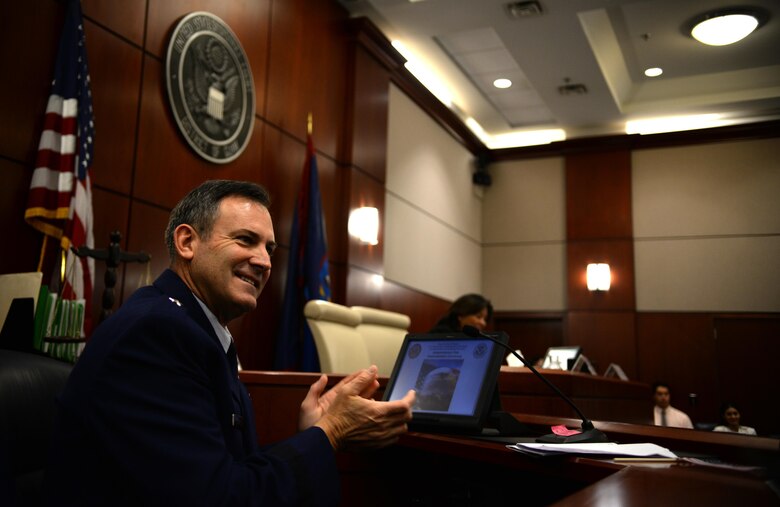 U.S. Air Force Brig. Gen. Andrew Toth, 36th Wing commander, applauds as new U.S. citizens are recognized during a naturalization ceremony July 2, 2015, in Hagåtña, Guam. Twenty-four immigrants, originally from the Federated States of Micronesia, the Philippines, South Korea, Taiwan, Thailand and Vietnam, received their U.S. citizenship at the District Court of Guam. (U.S. Air Force photo by Senior Airman Alexander W. Riedel/Released)
