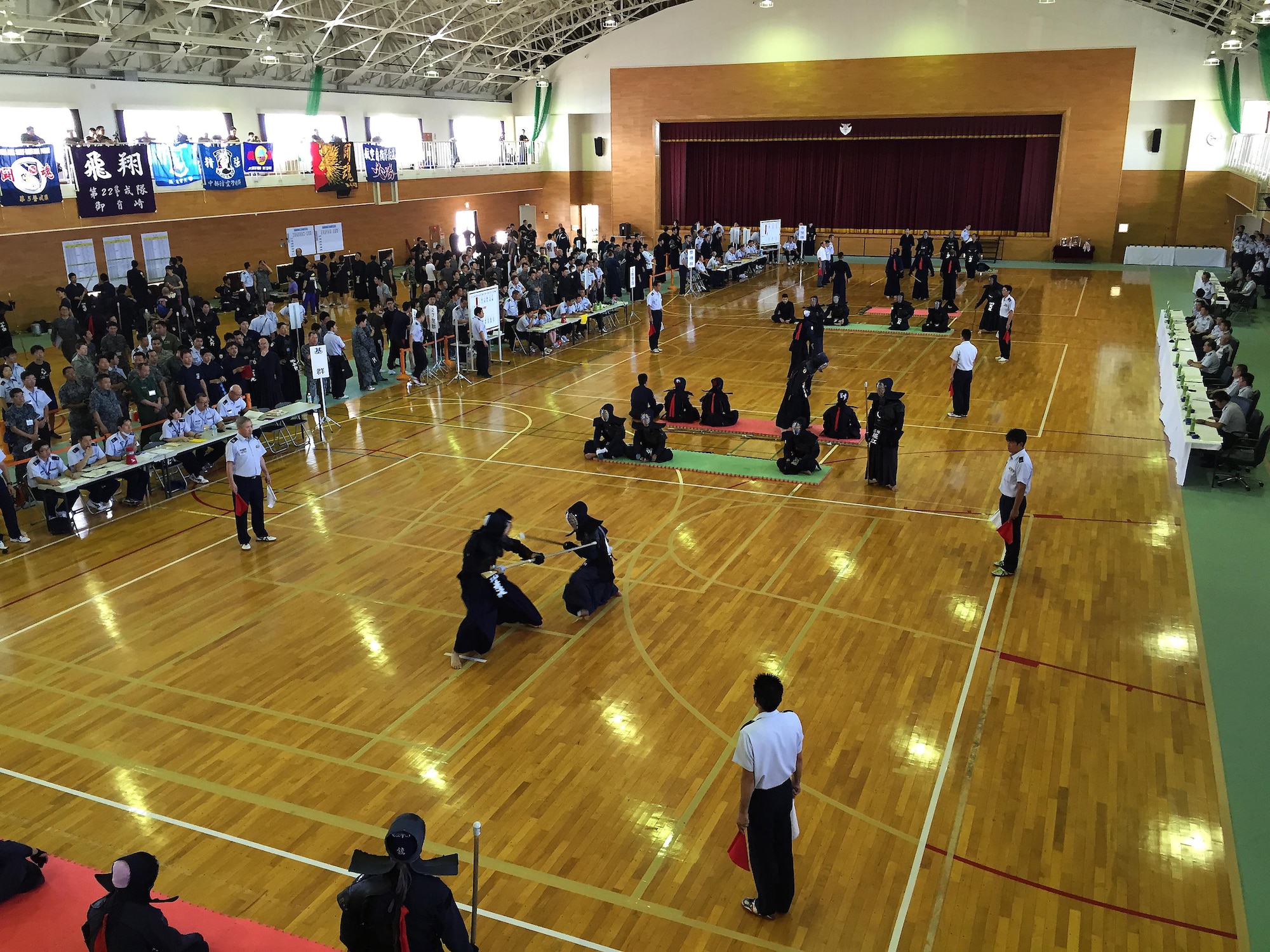 Japanese Kendo, Ju Kendo and Kempo tournament participants spar during the tournament June 25, 2015, near Iruma Air Base, Japan. The 623rd Air Control Flight "Lightsword" combined with their Japan Air Self-Defense Force counterparts during a temporary deployment to Iruma Air Base, Japan, to strengthen bilateral relations June 22 through 26, 2015. (U.S. Air Force courtesy photo by Lt. Col. Daniel Biehl/Released)