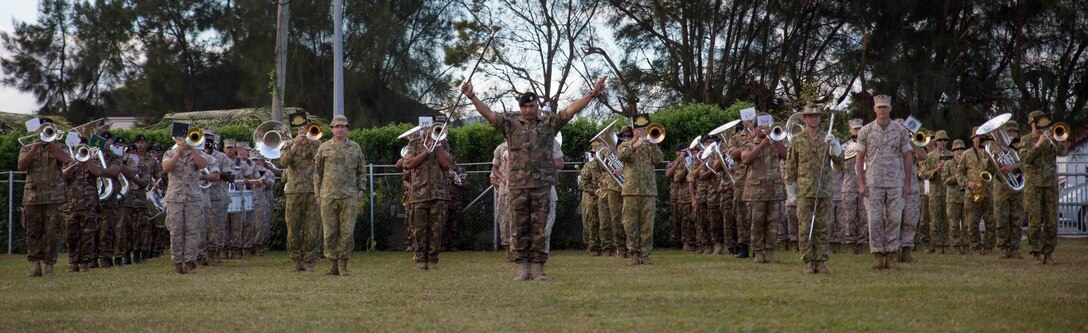 The U.S. Marine Corps Forces, Pacific Band rehearses alongside The Australian Army Band and Tonga's Royal Corps of Musicians in preparation for the coronation of King Tupou VI in Nuku’alofa, Tonga, July 2, 2015. The U.S. and Tonga have sustained strong partnerships for years that continue to improve through participation in cultural events, such as the king’s coronation. 